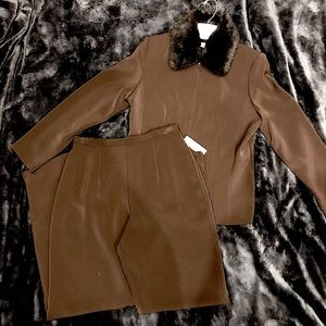 Chocolate brown two piece women’s suit with faux fur collar